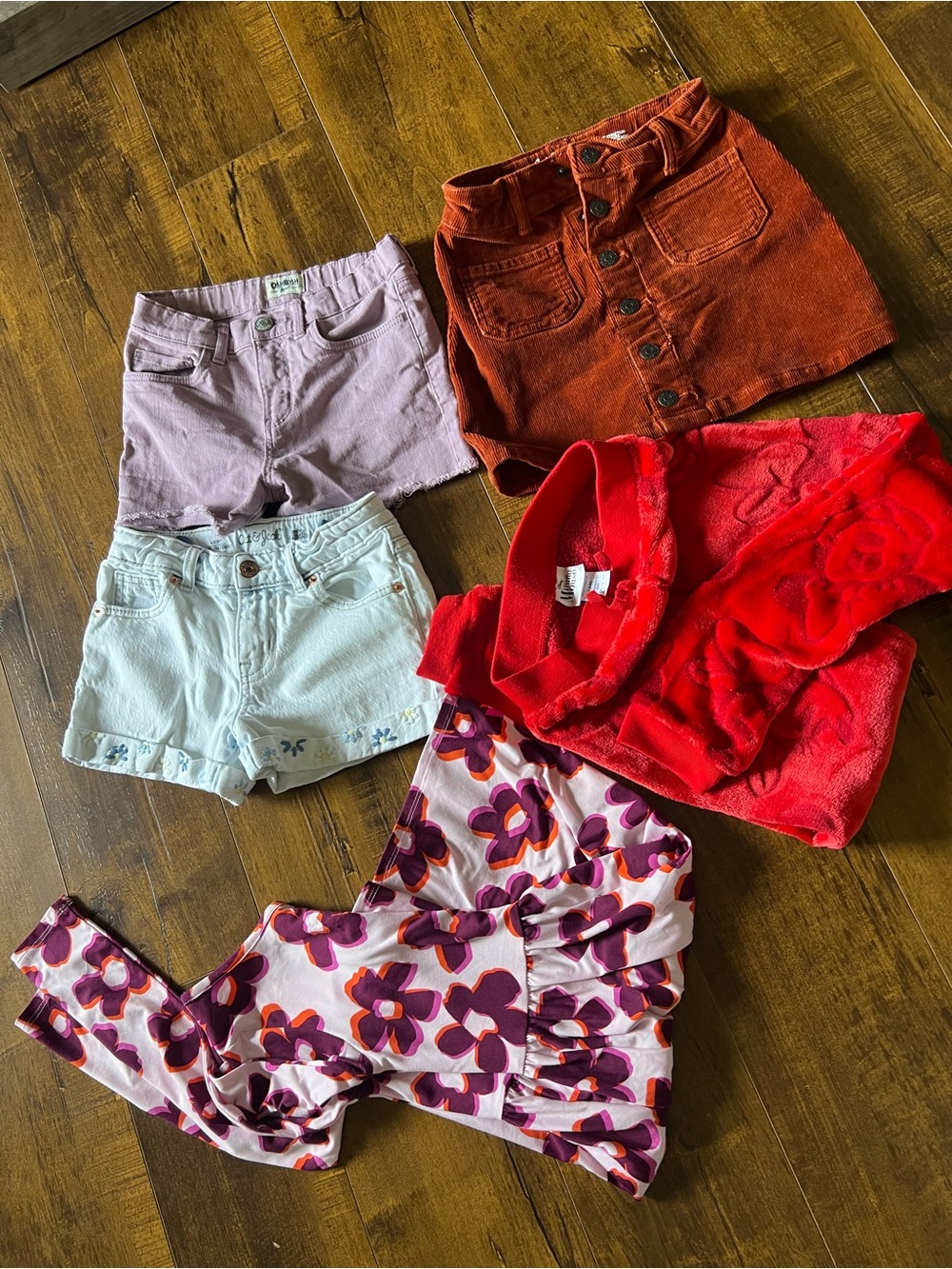 Girls Mixed Clothing Bundle - Floral Top, Red Sweater, Corduroy Skirt, Shorts